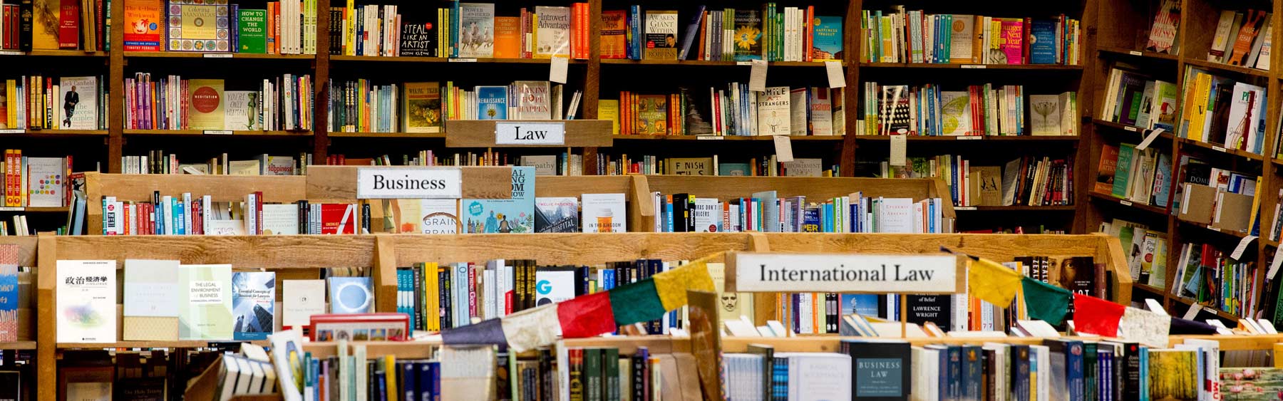 A book store with a lot of books on the shelves.